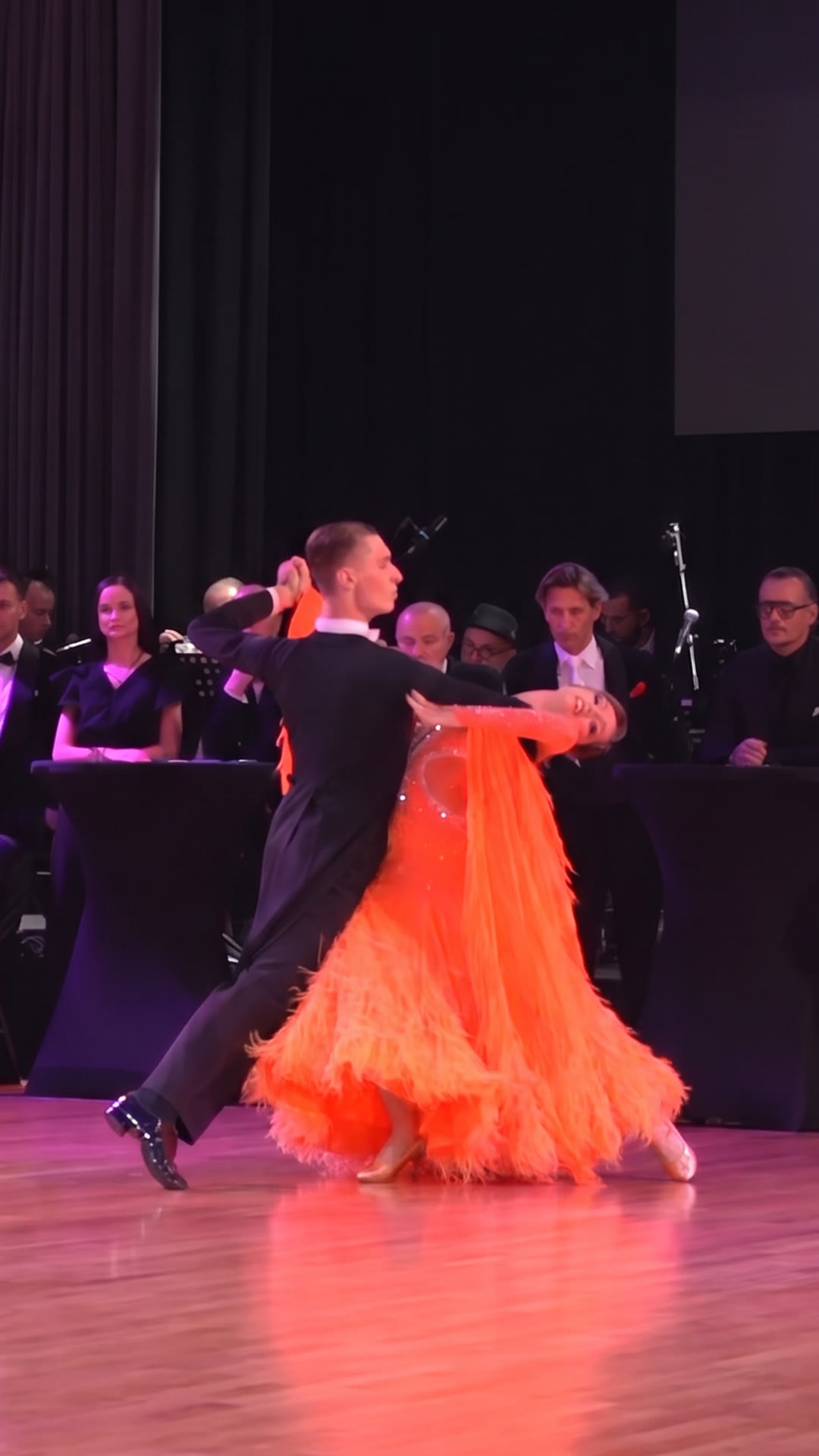 Ballroom couple dancing Tango in a dramatic close hold
