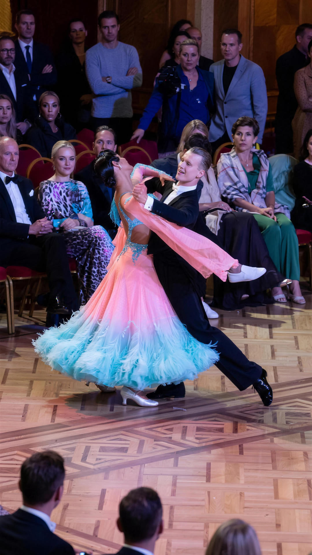 Ballroom couple dancing a Viennese Waltz natural turn